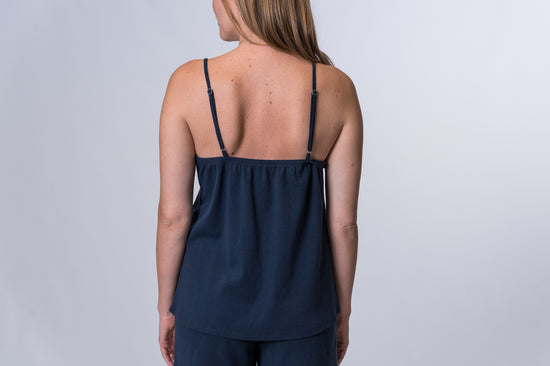 Load image into Gallery viewer, Woman wearing a dark blue tank top and matching drawstring lounge pants. Back of clothing is being shown
